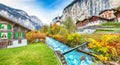 Stunning autumn view of Lauterbrunnen village with awesome waterfall  Staubbach  and Swiss Alps in the background Royalty Free Stock Photo