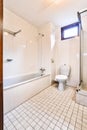 A stunning bathroom a small tiled floor