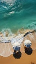 Stunning beach scene from above, with umbrellas, turquoise sea, and loungers