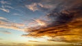 Stunning beach sunset with dramatic clouds and serene waters Royalty Free Stock Photo