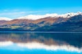 Stunning beautiful view beside lake Wanaka with alps mountain. Noon scenery with blue sky. I Royalty Free Stock Photo