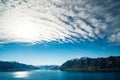 Stunning beautiful view beside lake Wanaka with alps mountain. Noon scenery with some cloudy and blue sky. I Royalty Free Stock Photo