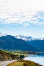 Stunning beautiful view of the road beside Lake Wanaka with alps mountain. Noon scenery with some cloudy and blue sky. nature Royalty Free Stock Photo