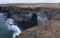 Stunning Black Sand Beach with Basalt Columns in Iceland