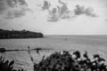 Stunning black and white shot of a sailboat in the middle of the vast open ocean: Tropea Royalty Free Stock Photo