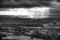Black and white beautiful sunbeams over Big Moor in the Peak Dis Royalty Free Stock Photo