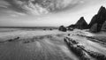 Stunning black and white sunset landscape image of Westcombe Beach in Devon England