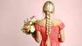 A Stunning Blonde Beauty in a Red Dress, Holding a Bouquet of Tender Pale Pink Roses. Generative AI