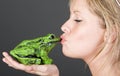 Stunning Blonde Girl Kissing a Frog Royalty Free Stock Photo