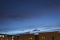 Stunning blue and violet sunset at blue hour with venus planet at the right top of composition and residential units buildings Royalty Free Stock Photo