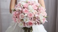 Stunning bridal bouquet showcasing an assortment of exquisite flowers gracefully held in hands Royalty Free Stock Photo