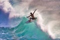 Close-up of a silhouetted surfer on a clean aquamarine wave on Maui. Royalty Free Stock Photo