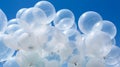 Translucent White Balloons Floating Against Vibrant Blue Sky