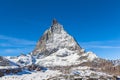 Stunning close up view of the famous Matterhorn peak of Swiss Alps on sunny autumn day with snow and blue sky cloud, from cable