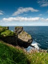 Stunning coastline of Ireland in Kilkee area. Low cloudy sky, warm sunny day. Travel, tourism and sightseeing concept. Irish