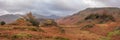 Stunning colorful Autumn landscape image of view from Castle Crag towards High Stile and Glaramara in Lake District Royalty Free Stock Photo