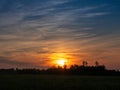 Stunning colorful sunset sky over a forest silhouette. Warm and cool color. Beautiful nature scene. Calm and relaxing mood and Royalty Free Stock Photo