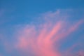 Stunning colorful twilight sky at sunrise with bright vibrant pink cloud