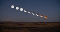 Lunar Eclipse Sequence Over Desert Landscape at Night Royalty Free Stock Photo
