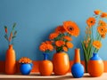 A stunning composition unfolds as orange flowers bloom gracefully in a vase set against a backdrop of soothing blue.