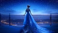 A Beautiful Queen or Princess Wearing a Flowy Sparkling Neon Blue Dress on a High Balcony Looking Down at City Lights Royalty Free Stock Photo