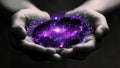 Palm of Hands Holding a Cosmic Glowing Purple Galaxy and Galactic Stars and Constellations (Black Hole) Royalty Free Stock Photo