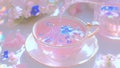 A Porcelain Teacup Being FIlled With a Warm, Comforting, Transparent, Fruity, Pink Tea Drink Beverage With Flowers for Garnish Royalty Free Stock Photo