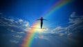 A Man Walking on a Tightrope in a Blue Sky With White Clouds Background With a Rainbow (Success, Resilience Symbol) Royalty Free Stock Photo
