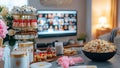Tasty Yummy Pajama Party Finger Foods, Sweets, Appetizers, Aperitives and Popcorn in the Living Room With Decorations and a TV Royalty Free Stock Photo