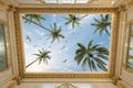 Ceiling wallpaper with gold gypsum molding and palm trees Royalty Free Stock Photo