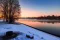 Stunning winter sunset fog hovers over river Royalty Free Stock Photo