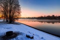 Stunning winter sunset fog hovers over river