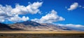 Stunning desert landscape with mountains and dramatic clouds under blue sky, copy space for text Royalty Free Stock Photo