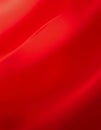 A stunning display of red silk fabric undulates gently, reflecting light in captivating waves Generative AI