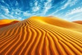 Stunning and dramatic desert vista with golden sand under a crystal clear blue sky