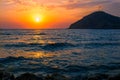 Dramatic orange sunset over the Turkish beach of Gumusluk