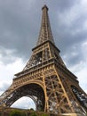 Stunning Eiffel Tower view with dark clouds. Closeup capture aiming to show different aspect of Eiffel tower in bad wheather Royalty Free Stock Photo