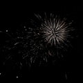 Stunning fireworks display explodes across a dark night sky, creating a vibrant and dynamic scene. Perfect for celebratory