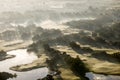 Stunning Foggy Aerial Perspective Of A Golf Course At Dawn