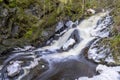Stunning Frozen Hassafallen Waterfall in Wintry Rural Woodlands