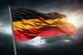 Stunning German flag flowing with the wind against a dramatic moody sunset sky