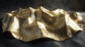 Gold Surface Shows Various Curves and Angles on a Stone Background Royalty Free Stock Photo