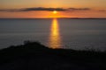 Stunning golden sunset from the Cliffs of Moher looking out towards the island of Inisheer, Ireland