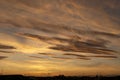 Stunning golden sunset over the roofs of San Siro in Milan with orange clouds in the sky Royalty Free Stock Photo