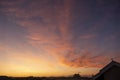 Stunning golden sunset over the roofs of San Siro in Milan with orange clouds in the sky Royalty Free Stock Photo