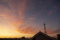 Stunning golden sunset over the roofs of San Siro in Milan with orange clouds in the sky Royalty Free Stock Photo