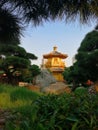 Stunning golden temple in the middle of garden