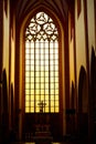 Stunning gorgeous sunset light through an old medieval Gothic church window in Europe. Royalty Free Stock Photo