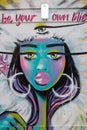 Stunning graffiti of a three eyed lady in shoreditch