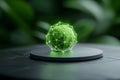 Green geometric object with glowing lines on a dark surface against a blurred green background Royalty Free Stock Photo